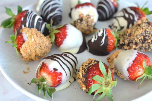 close-up view of a circular plate adorned with a delicious assortment of chocolate-coated strawberries