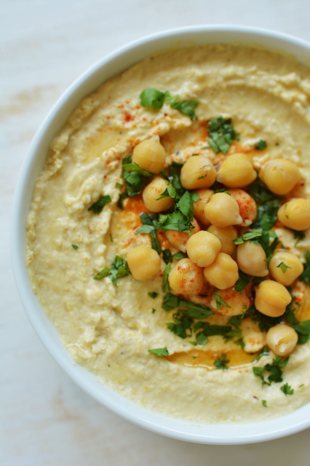 This simple hummus recipe is the only one you'll ever need in your kitchen! Creamy, delicious and super easy! From Lauren Caris Cooks