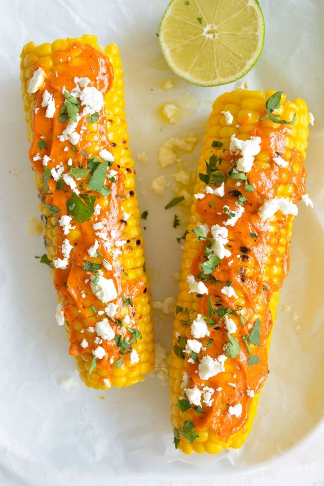 How to grill the PERFECT corn on the cob, then smother it in lime butter, smokey mayo, feta cheese and fresh coriander! From Lauren Caris Cooks