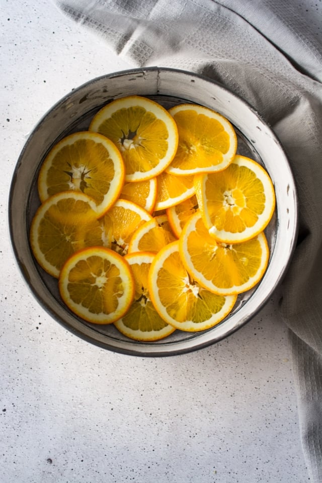 Orange and Rosemary marry in this light, orange upside down cake. Moist, delicate and not too sweet, a slice of this cake is perfect for your afternoon tea or coffee!