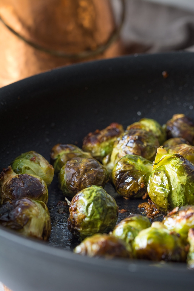 Roasted brussels sprouts in a frying pan.