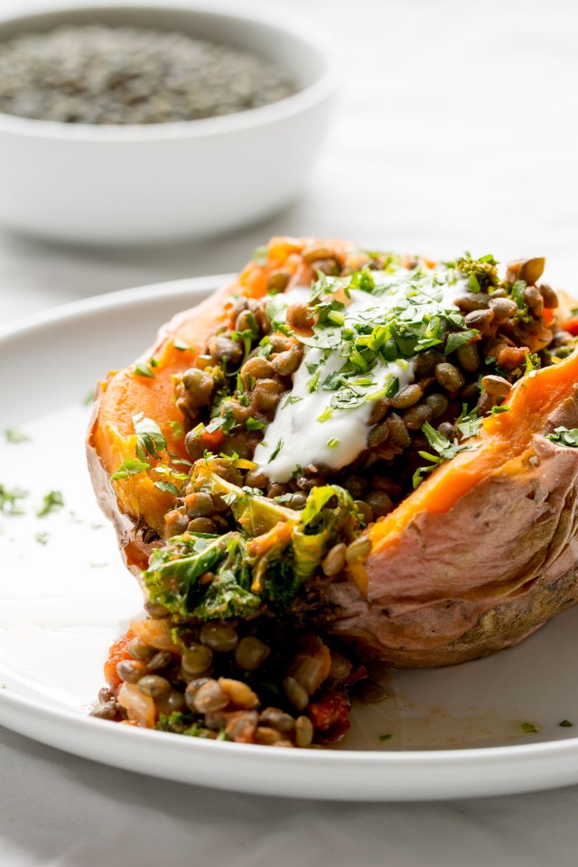 Stuffed Sweet Potatoes with lentils, kale and sun dried tomatoes are a great warming meal when it's freezing cold outside!