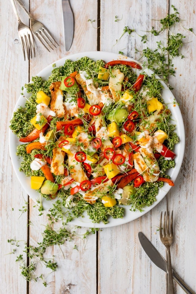 A deliciously fresh halloumi and quinoa salad with all the colours of the rainbow! Herby and zesty, topped with avocado, mango and Halloumi cheese, this salad has everything!