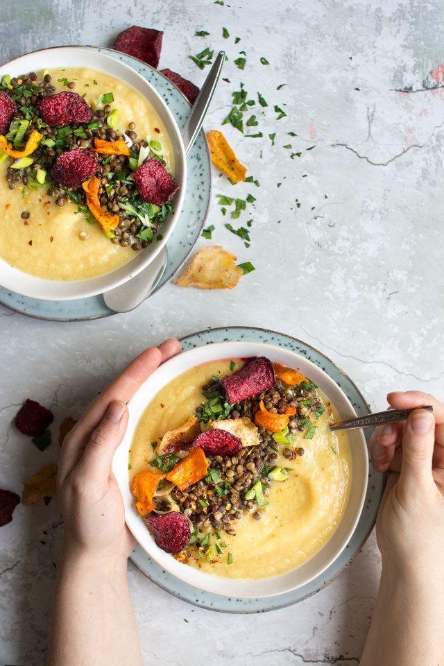 A delicious, sweet parsnip and apple soup, loaded with lentils and roasted vegetable crisps