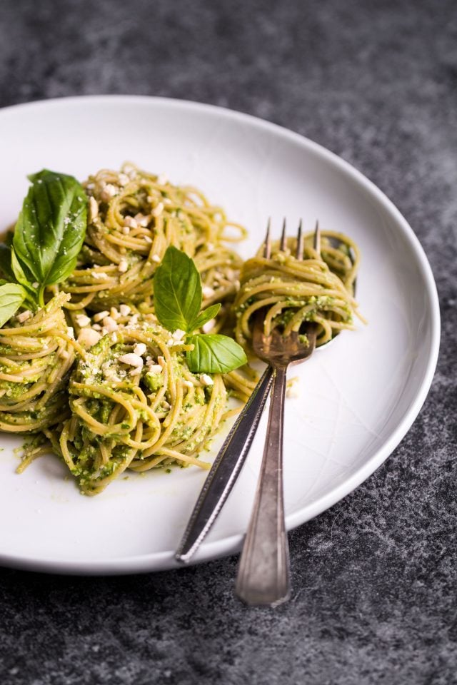 This simple recipe for oil free pesto is totally vegan, and features basil, cashew nuts and avocado. It's a super simple, staple dinner that's whipped up in no time!
