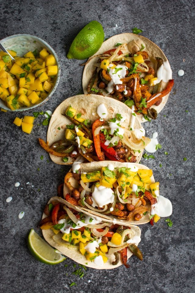 These vegan bean tacos only take one tray and are served with the freshest, zingy-est mango salsa!